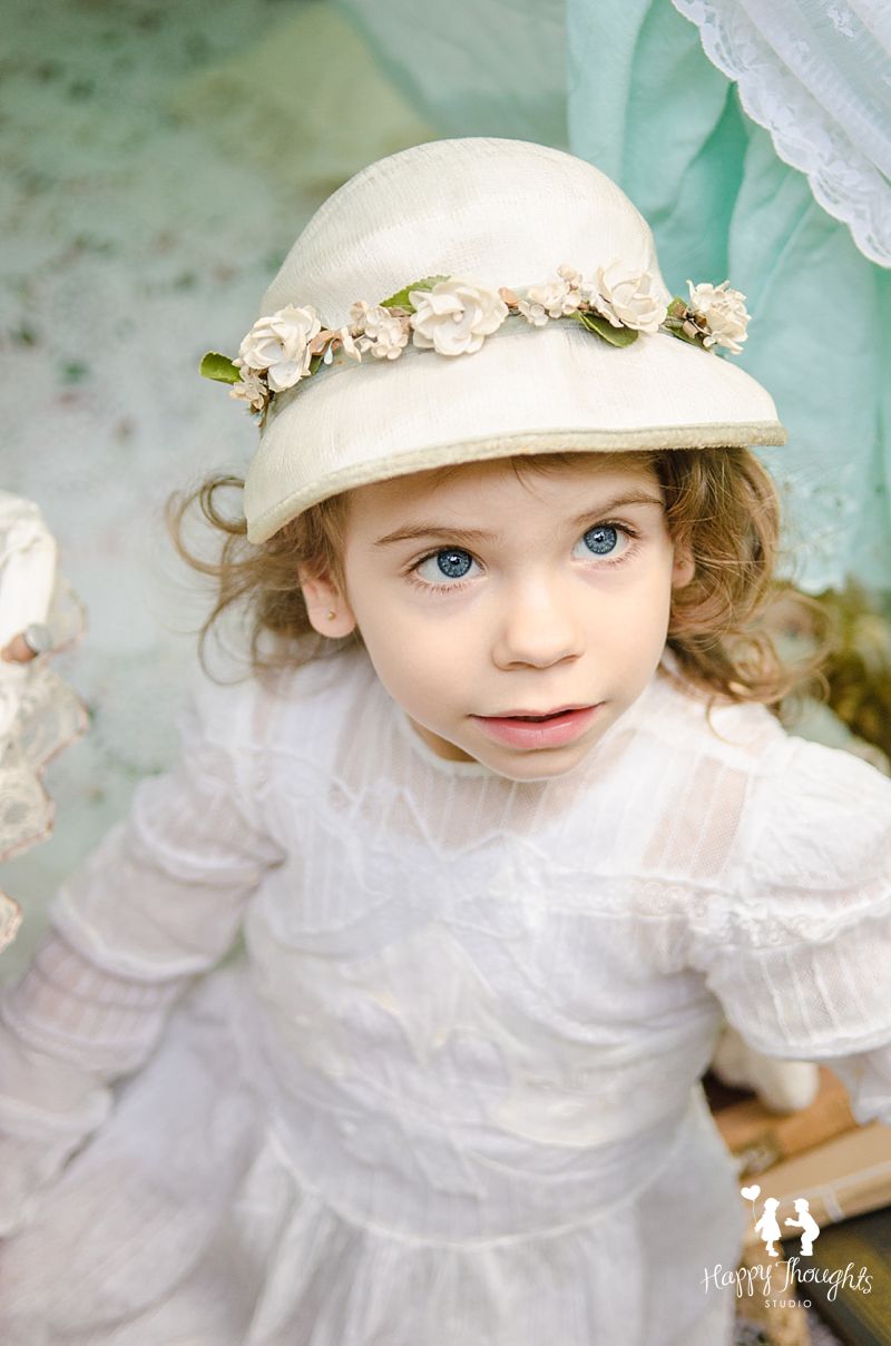 girl in vintage dress and bonnet 