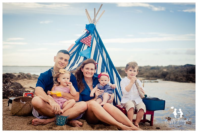 family at the beach teepee