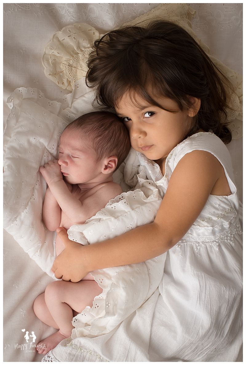 Newborn baby boy with sister photography