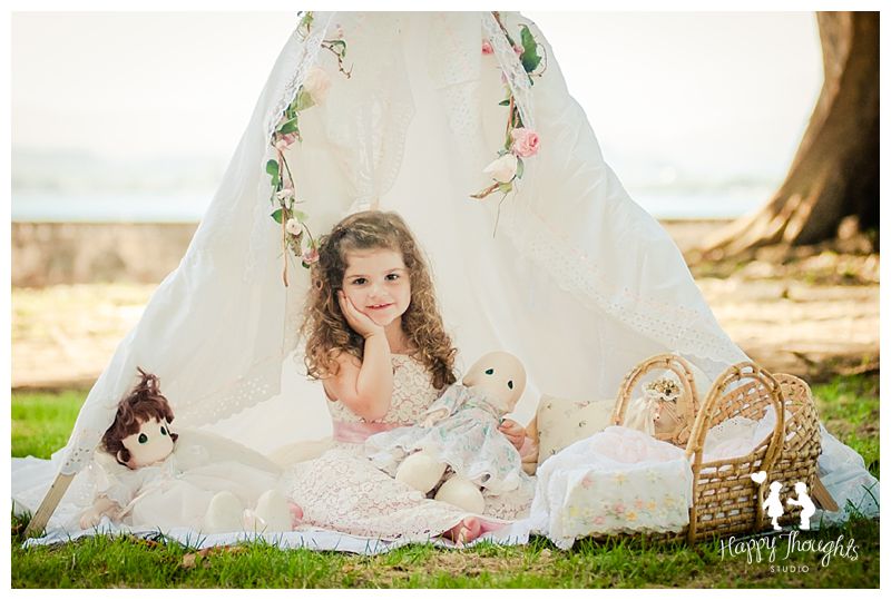 Girl playing with dolls in outdoors tent Children Photography