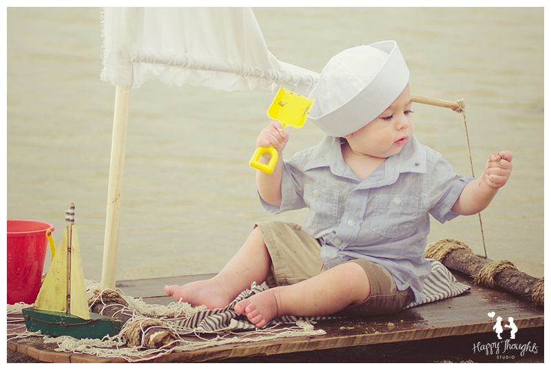Baby boy on a Vintage Sail-raft boat